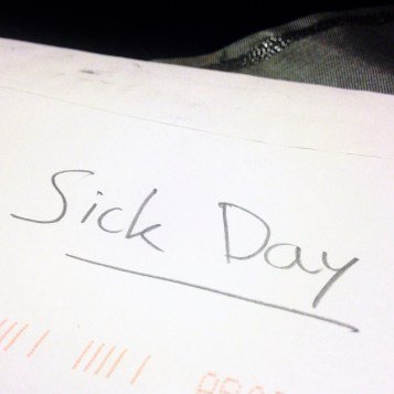 words "sick day" written on sheet of paper