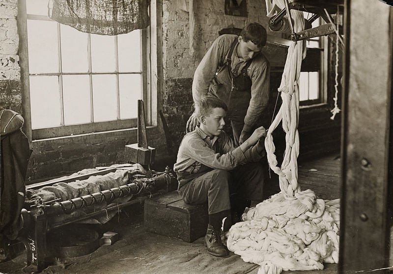 Boy at a weaving station - circa 1908