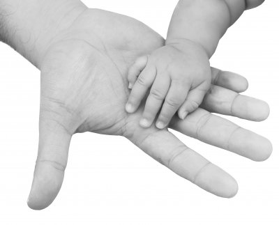 Father and baby hand