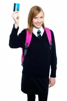 Teenage student holding credit card